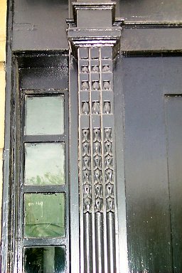 Detail of the carving on the pillars left and right of the door