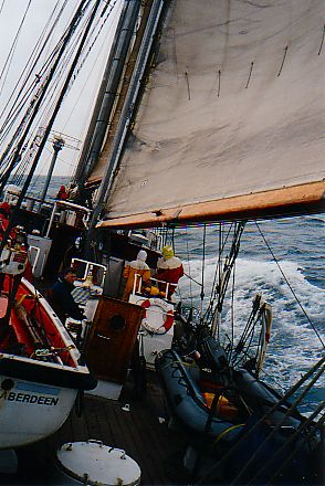 Picture of a tall ship leaning over under sails