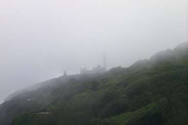 Picture of fog rolling in over a lighthouse