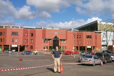 Picture of a person standing in front of Celtic Park football stadium