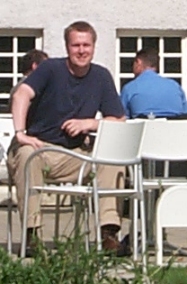 Picture of Armin sitting in the sun on a terrace