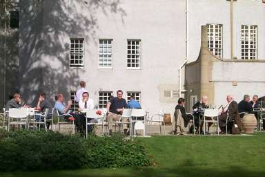 Picture of a terrace with people sitting at tables