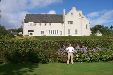 Picture of Armin standing in front of the house