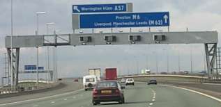 Picture of a view over the M6 motorway, sign above