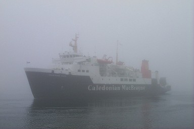 Picture of a ferry appearing out of fog