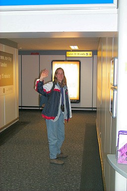 Picture of Imke waving good-bye at the departure gate
