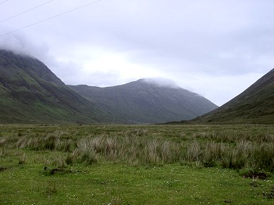 Picture of a glen with hills shrouded in clouds