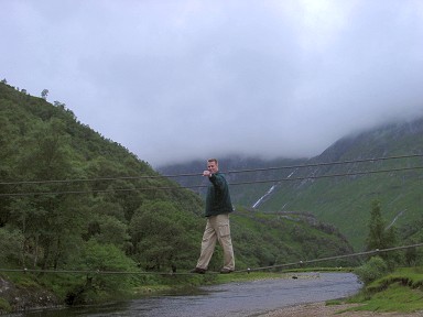 Picture of a three cable bridge, Armin standing on the bridge