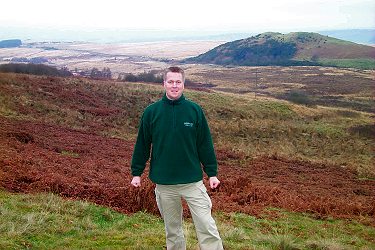 Picture of Armin in front of a landscape hidden in the haze