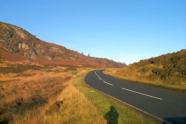 Picture of a road in the Trossachs, clear blue sky above
