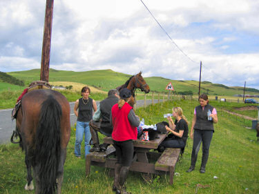 Picture of people and horse having lunch at Dunaverty Bay