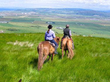 Picture of riders on a hill