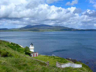 Picture of the lighthouse at McArthur's Head with Jura in the background