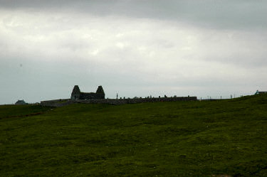 Picture of Kilnave chapel seen from the shore