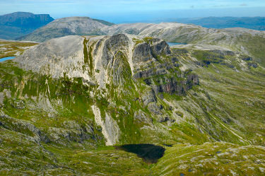 View over Quinag, Glas Bheinn and Beinn an Fhurain from the ridge between Conival and Ben More Assynt Picture of a view over three mountains