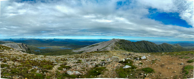 Picture of a panoramic view over a ridge and wide landscape