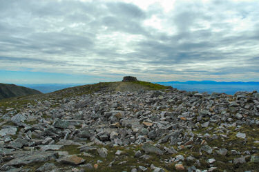 Approaching the summit of Conival Picture of a rocky surface with a cairn