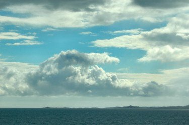 Picture of clouds breaking up over the sea