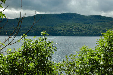 Picture of a view over Loch Ness, a boat is travelling past