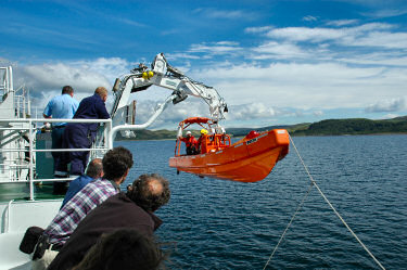 Picture of a boat being lifted up again