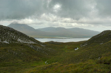 Picture of a view along a bealach over a sound to another island