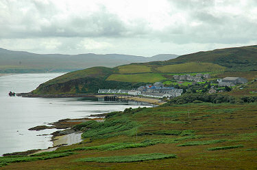 Picture of a bay with a distillery and village