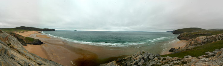 Panoramic picture of a large bay with a sandy beach