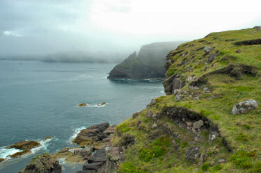 Picture of cliffs with mist and low clouds hanging over them