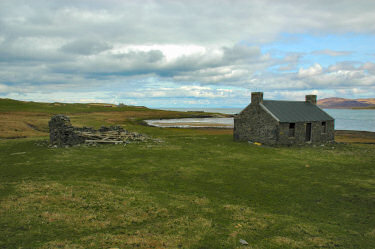 Picture of an old cottage near a shore