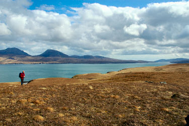 Picture of a sound between two islands, two mountains on the other island