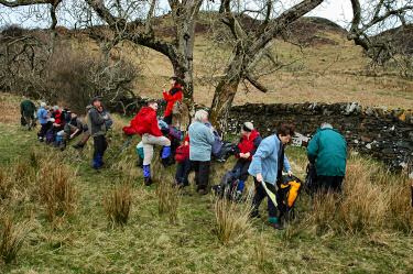 Picture of a group of walkers resting under a tree