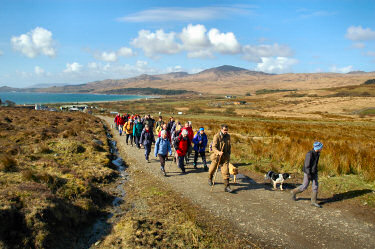 Picture of walkers on a track leading out of a croft
