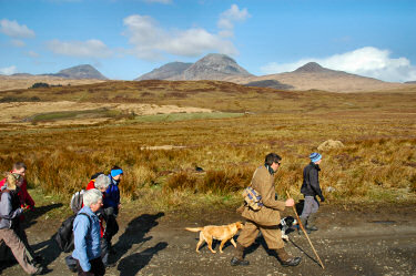 Picture of a group of walkers with the Paps of Jura in the background