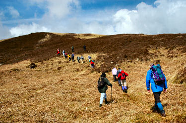 Picture of walkers up a steep hillside