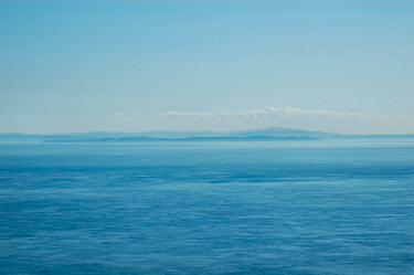 Picture of the silhouette of a land mass in the haze