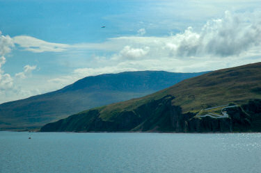 Picture of a lighthouse on cliffs above the sea