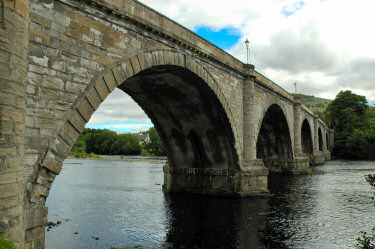 Picture of a bridge with multiple arches over a river