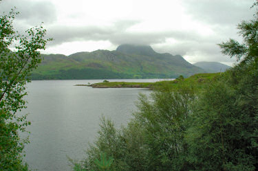 Picture of a view over a lake, sky covered by clouds