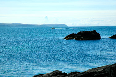 Picture of a boat coming into a sea loch