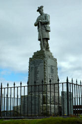 Picture of a war memorial with the statue of a soldier