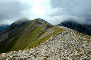 Picture of a mountain ridge with some low clouds