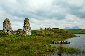 Picture of the ruins of an old settlement on a small island in a loch (lake)