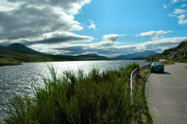 Picture of a loch (lake), a road beside it