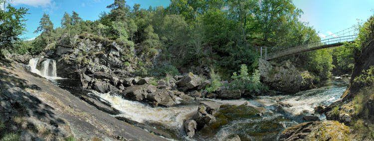 Picture of a panoramic view of a waterfall and a bridge over the river