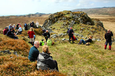 Picture of walkers enjoying a rest in the sun on an ancient hill fort