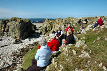 Picture of people sitting on rocks