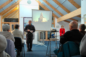 Picture of a presenter standing in front of an audience