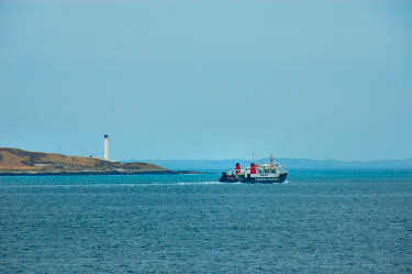 Picture of a ferry passing a lighthouse