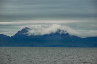 Picture of clouds moving in on some high mountains