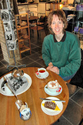 Picture of a young woman sitting at a coffee table